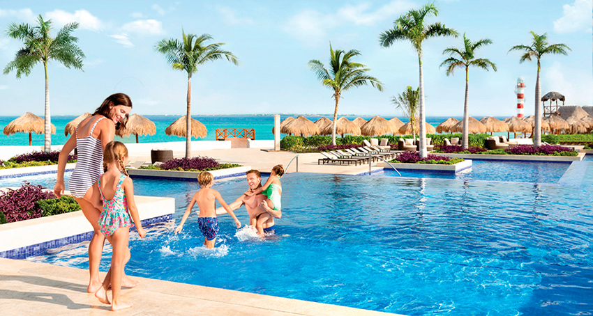 Family relaxing at the main pool at Hyatt Ziva Cancun