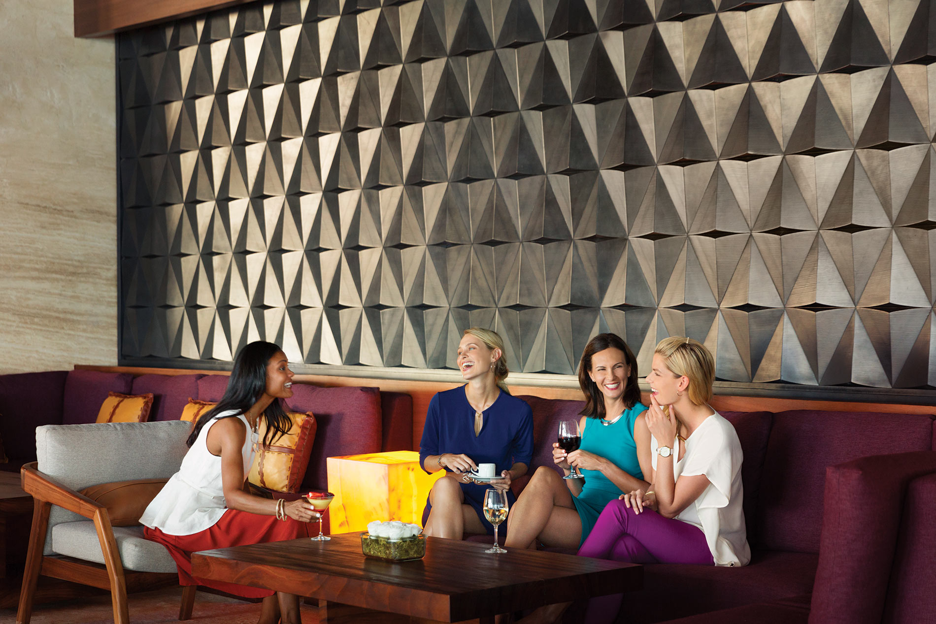 Hyatt Ziva Cancun a group of friends chatting and laughing.