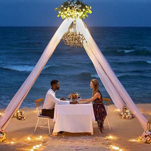 Romantic dinner at the beach.